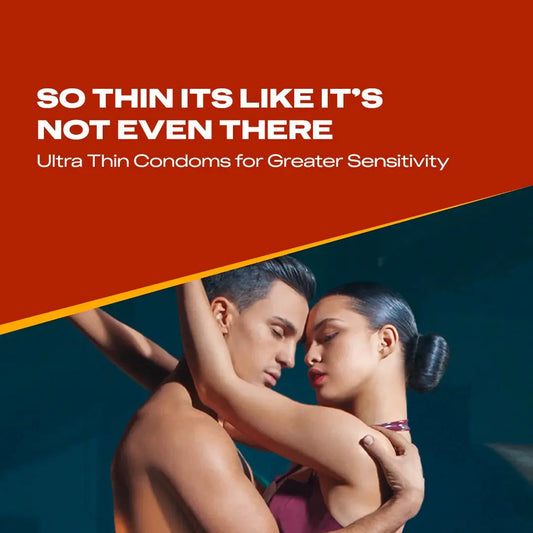Advertisement for ultra thin condoms with a couple embracing on a red and blue background.