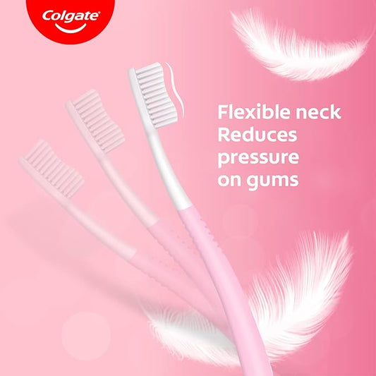 Colgate toothbrushes with feathers on a pink background