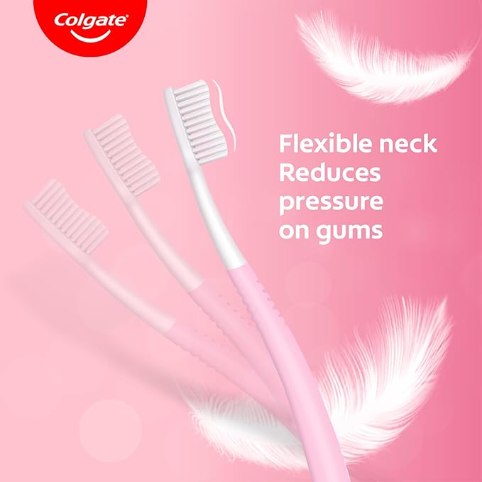 Colgate toothbrushes with feathers on a pink background