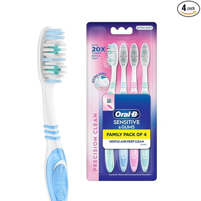 Oral-B toothbrush with packaging of four toothbrushes on a white background