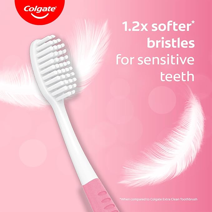 Colgate toothbrush with softer bristles on a pink background