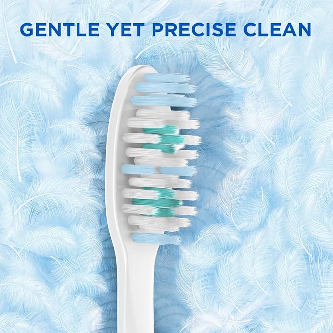 White toothbrush with blue bristle heads on a blue feather background with text 'GENTLE YET PRECISE CLEAN'.