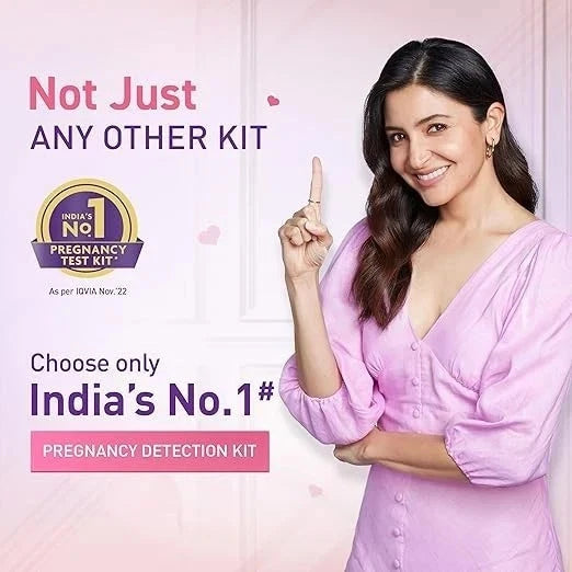 Woman in a pink dress pointing upwards with text about India's No. 1 pregnancy test kit.
